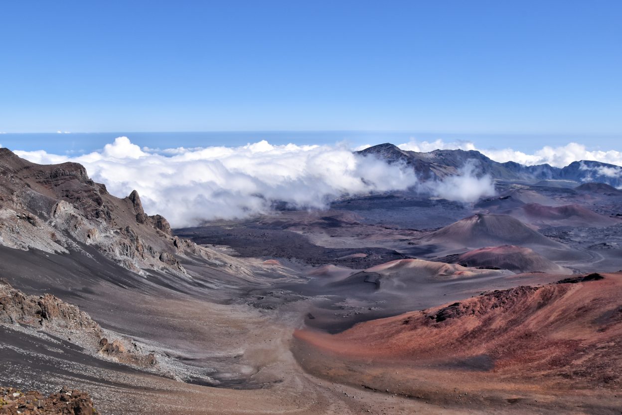 Haleakala Crater on the island of Maui is a unique Hawaiian spot--with an almost lunar landscape and the best stargazing opportunities you will ever find. Watching the sunrise from the summit and biking down the crater is the #1 recommended activity on Maui.