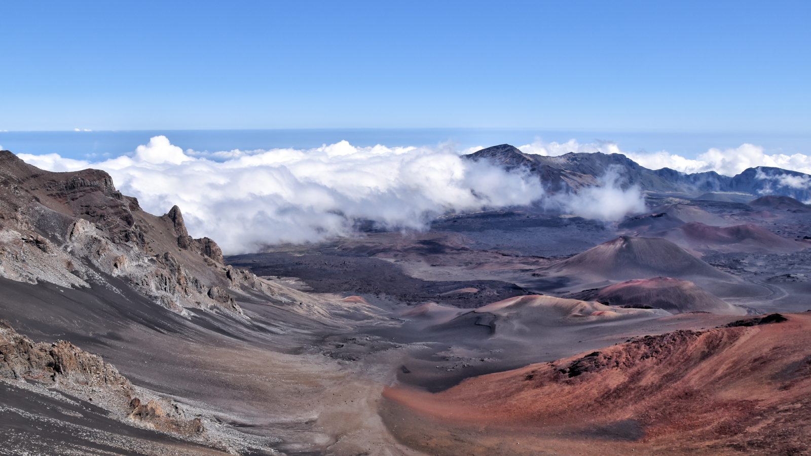 Haleakala Crater on the island of Maui is a unique Hawaiian spot--with an almost lunar landscape and the best stargazing opportunities you will ever find. Watching the sunrise from the summit and biking down the crater is the #1 recommended activity on Maui.