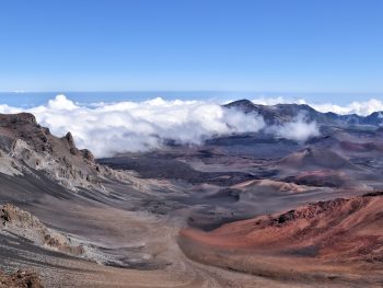 Haleakala Crater on the island of Maui is a unique Hawaiian spot--with an almost lunar landscape and the best stargazing opportunities you will ever find. Watching the sunrise from the summit and biking down the crater is the #1 recommended activity on Maui.