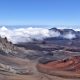 Haleakala Crater on the island of Maui is a unique Hawaiian spot--with an almost lunar landscape and the best stargazing opportunities you will ever find. Watching the sunrise from the summit and biking down the crater is the #1 recommended activity on Maui.