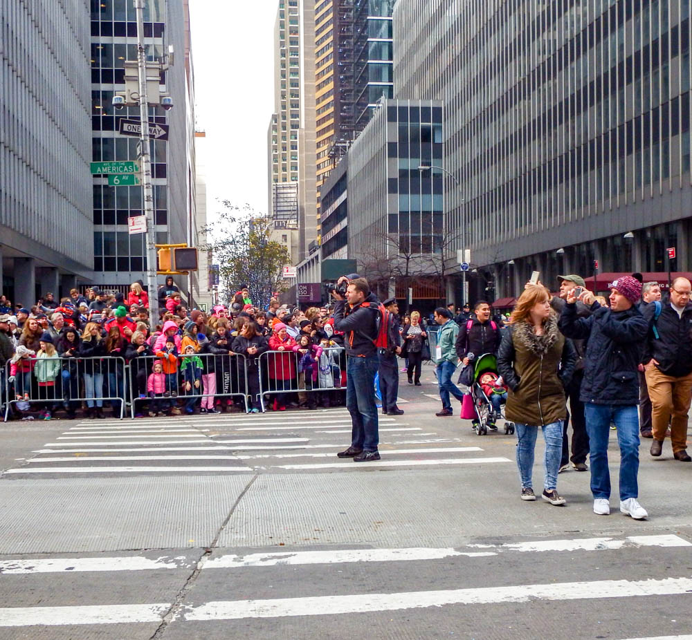 photographer in the middle of the street during the macys thanksgiving day parade