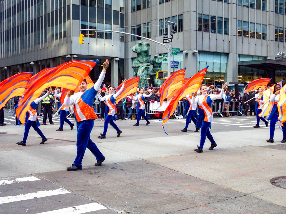 marchers waving colorful flags