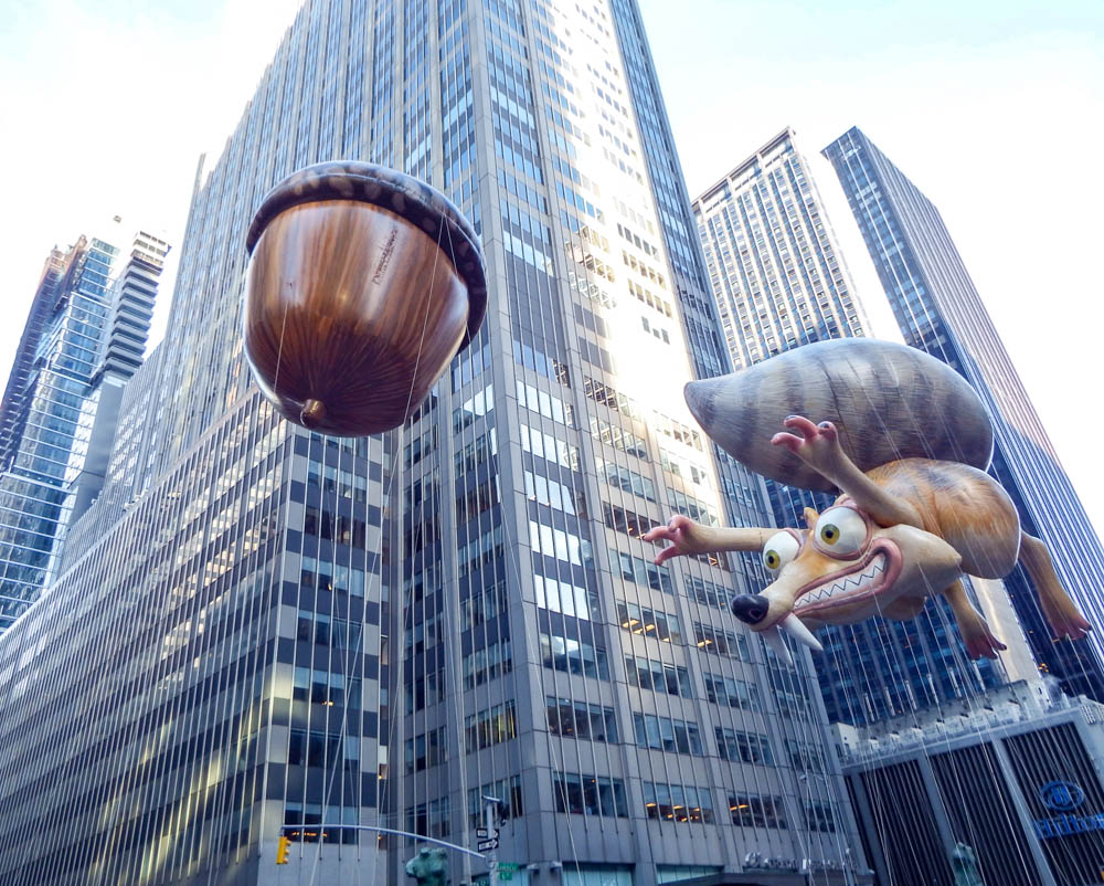 Ice Age squirrel and acorn balloons at the macys thanksgiving day parade