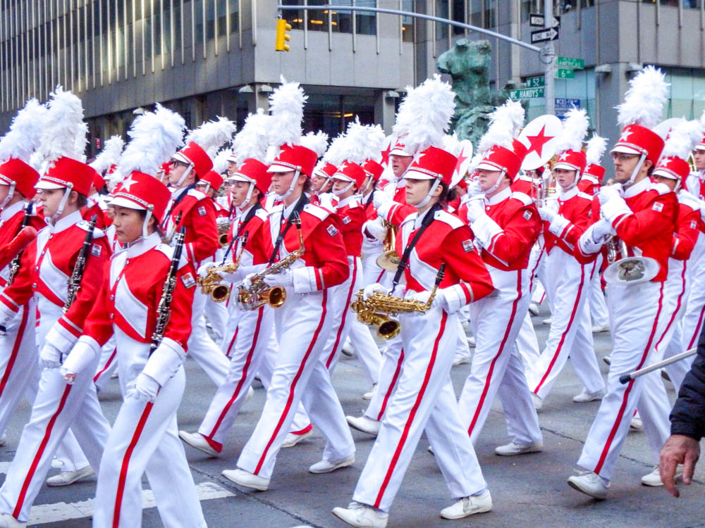 marching band in red and white uniforms