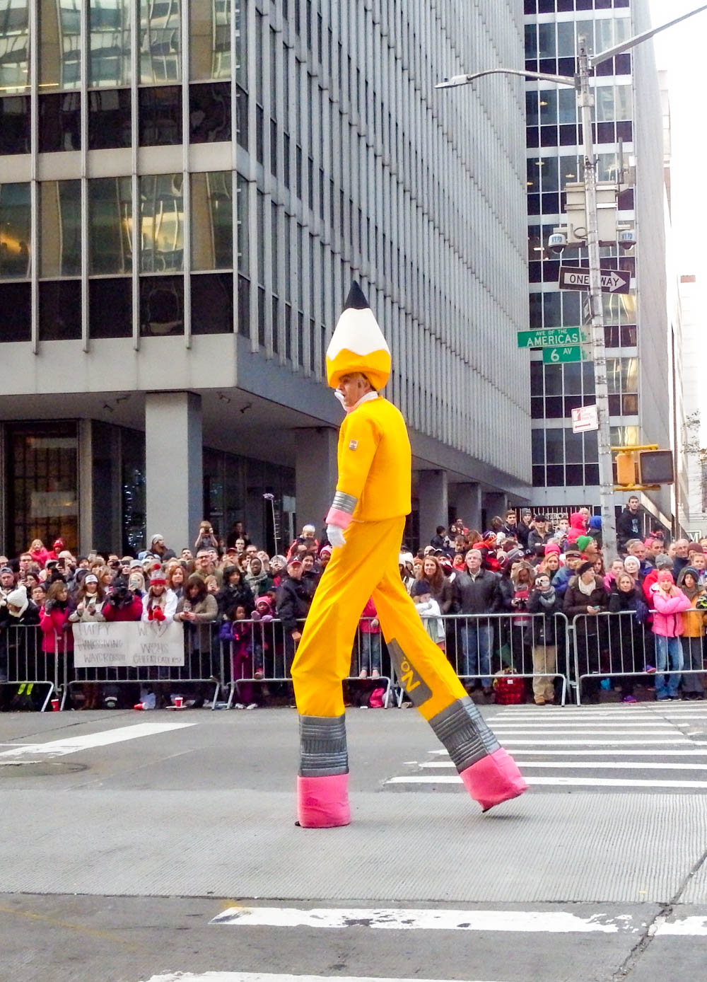 man dressed in a giant pencil costume at the macys thanksgiving day parade