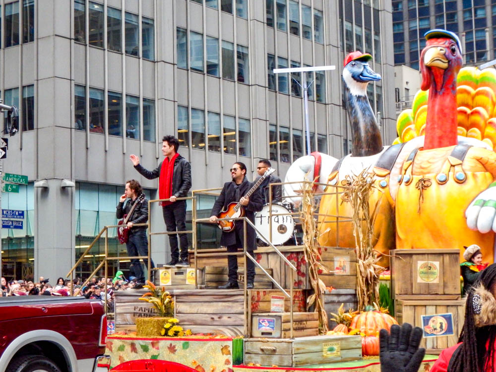 the band Train aboard a macy's parade float