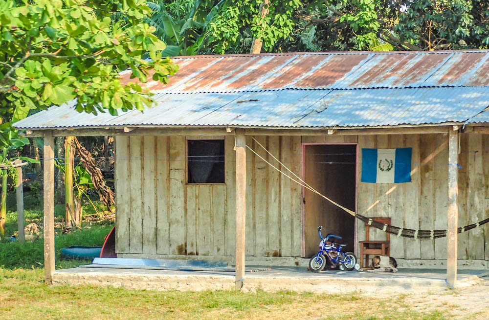 shack with a guatemala flag on it on belize to tikal day trip