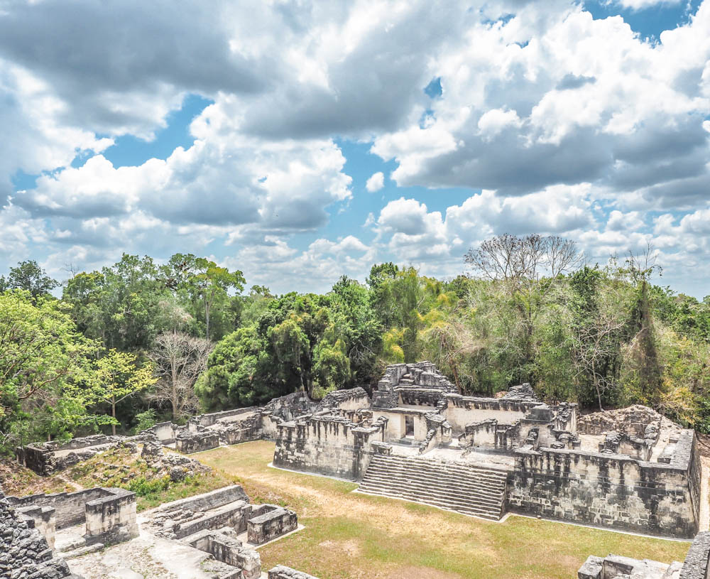 ancient ruins under big sky on sunny day on belize to tikal day trip