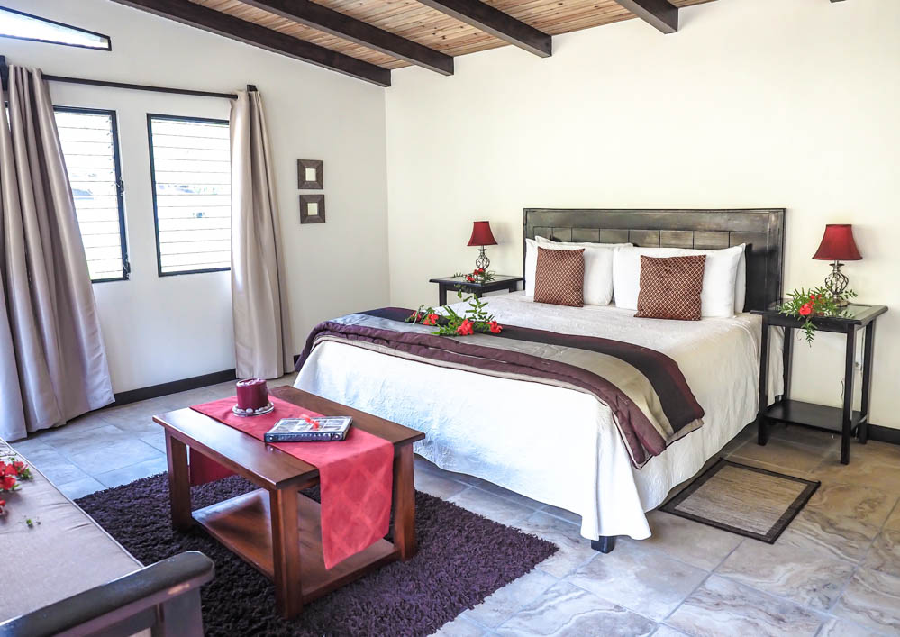 large bed inside a large cabin at black rock lodge in belize