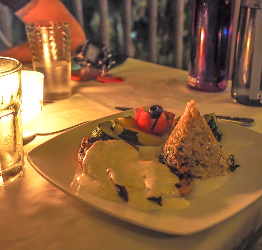 plate of food in candlelight at black rock lodge