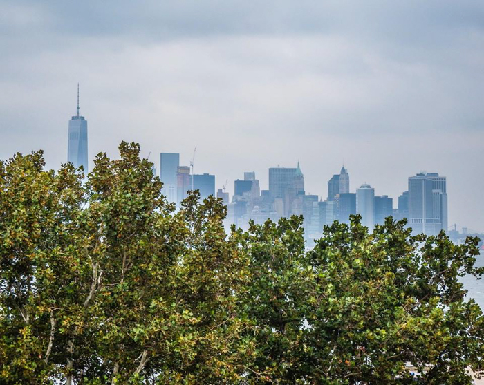 9/11 Museum and Memorial // a photo of the current downtown Manhattan skyline taken from Liberty Island, New York City
