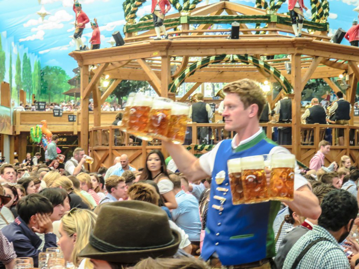 My Wanderlusty Oktoberfest Recap | What it's like at Oktoberfest in Munich, Germany | What it's like to travel to Oktoberfest with Thirsty Swagman | Oktoberfest beer tents | Oktoberfest food and beer | What to wear to Oktoberfest | Oktoberfirsts | carrying beers