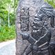 slate carving with maya figures and symbols in belize