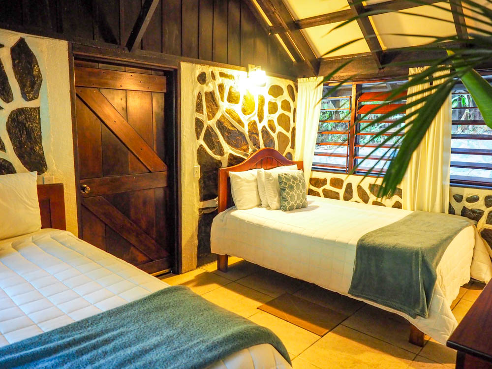 two beds in a jungle cabin in belize