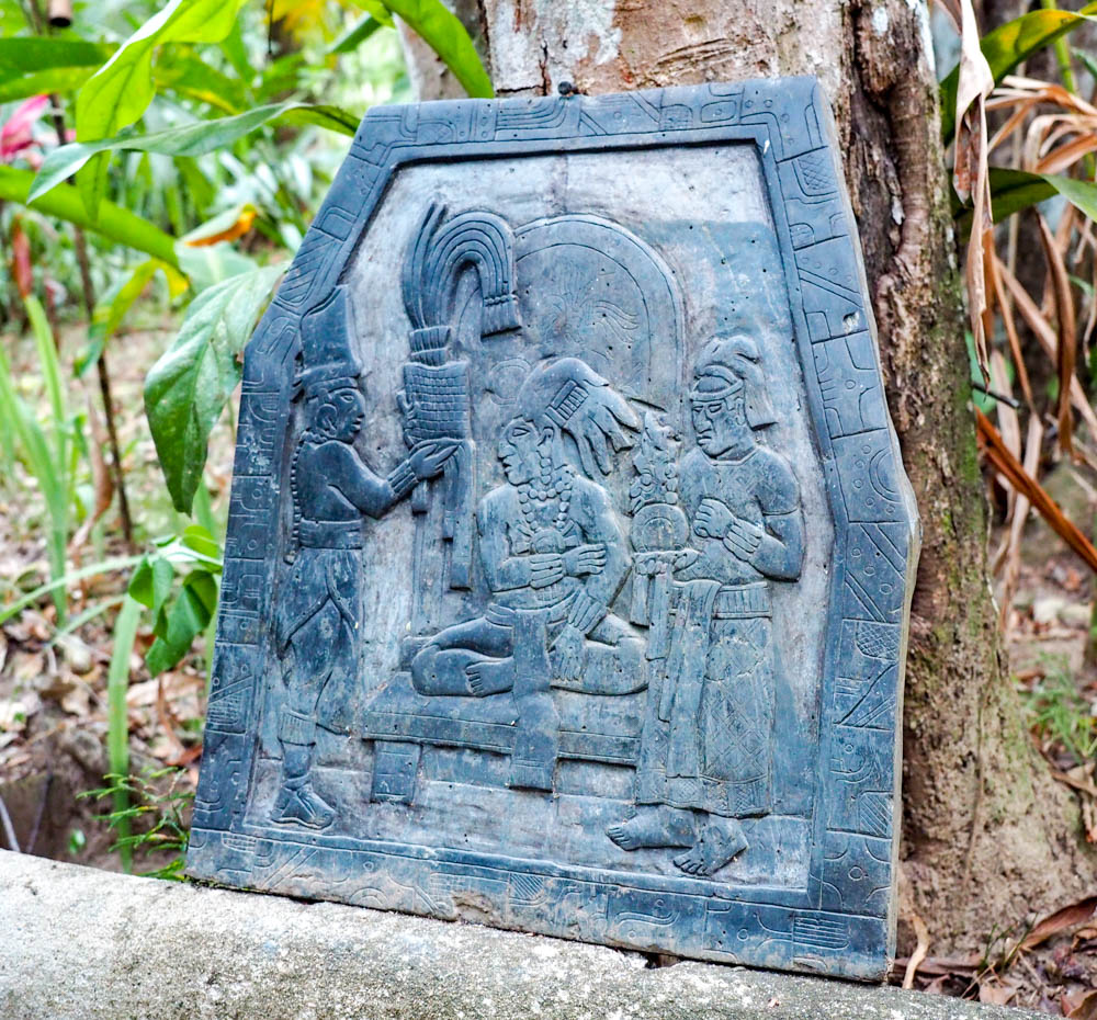 slate carving with maya figures in belize