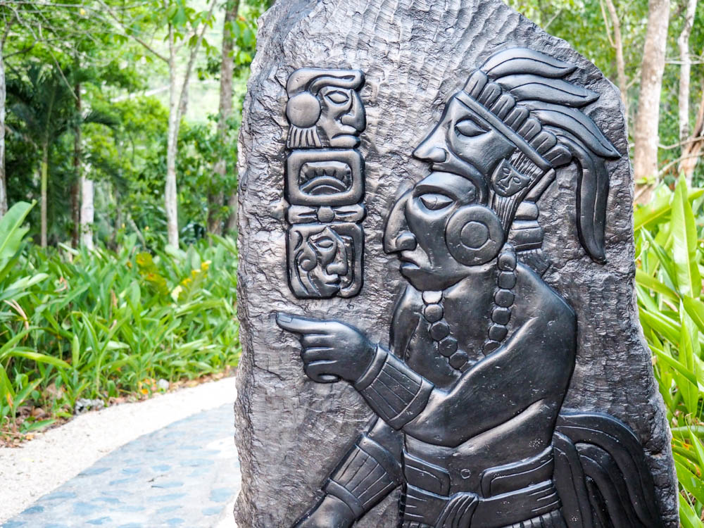 slate carving of maya figures