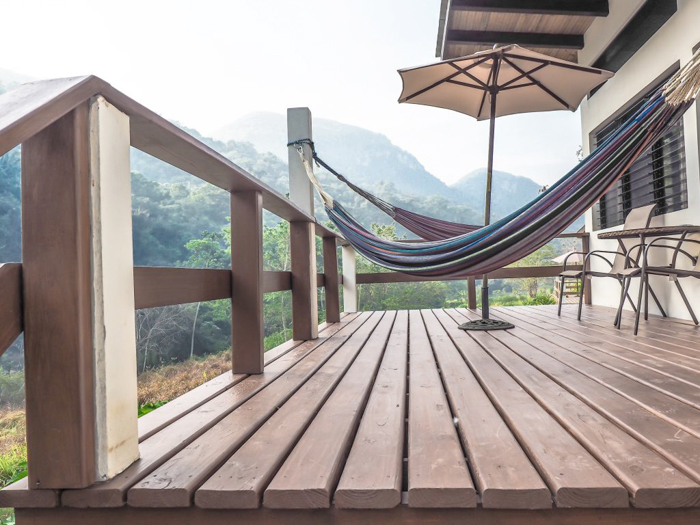 Deck and hammocks at our cabin at Black Rock Lodge in San Ignacio, Belize