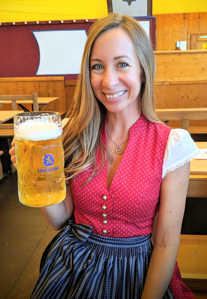 red high neckline dirndl | How to dress for Oktoberfest, a Complete and Honest Oktoberfest Packing Guide for dirndls | What to wear to Oktoberfest in Munich, Germany #oktoberfest #dirndl #munich #germany #festival #beerfestival