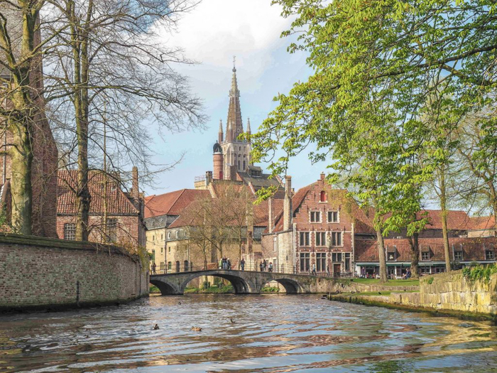 Bruges, Belgium | Canal boat ride, bridge, church, medieval architecture