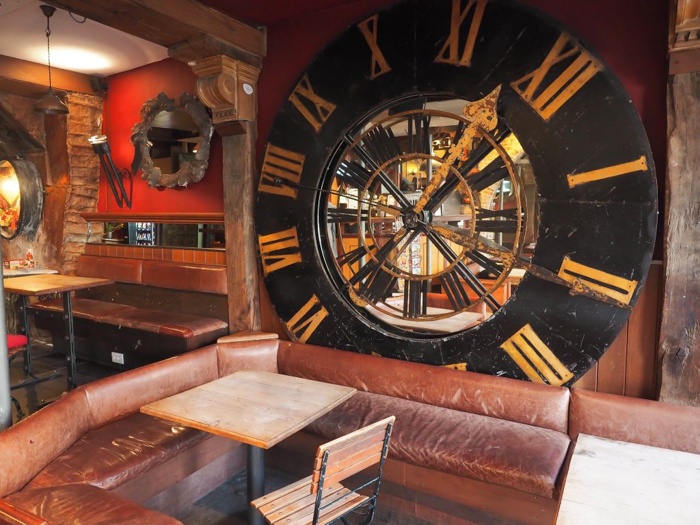 Lobby / reception area at St. Christopher's Inn Bruges, Belgium | Hostel at the Bauhaus | Brugge | giant clock