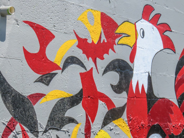 An exploration of Nashville Hot Chicken | Bolton's Spicy Chicken and Fish | Nashville, Tennessee | chicken and waffles, chicken tenders, spicy fried chicken | Southern cuisine | Soul food | outside of the building artwork