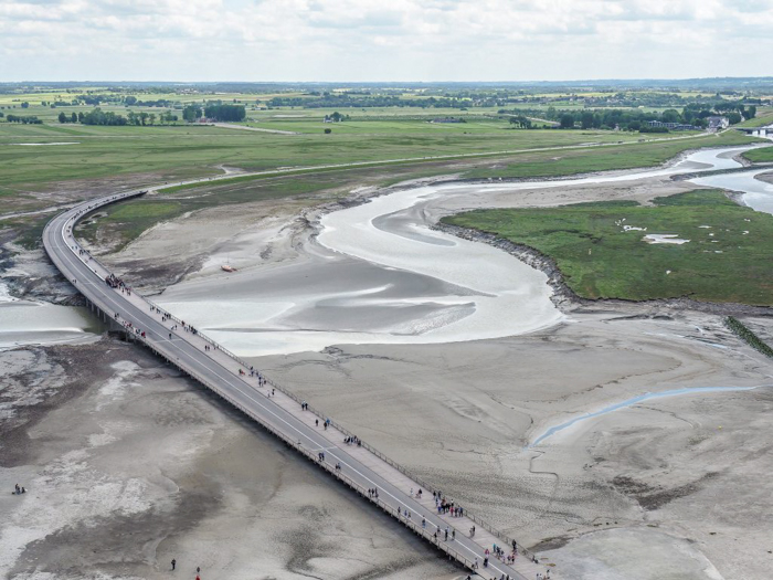 It's actually worth visiting Mont Saint Michel | Normandy, France | Medieval abbey on an island | Bucket list | Disney fairy tale castle inspiration | Mont-St-Michel | road at low tide