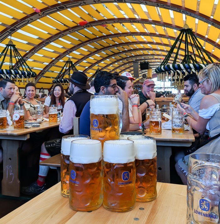 An Oktoberfest Tour Guide's Most Frequently Asked Oktoberfest Questions | Need to know Oktoberfest in Munich, Germany #oktoberfest #munich #germany #beer #festival | beers in the Löwenbräu tent