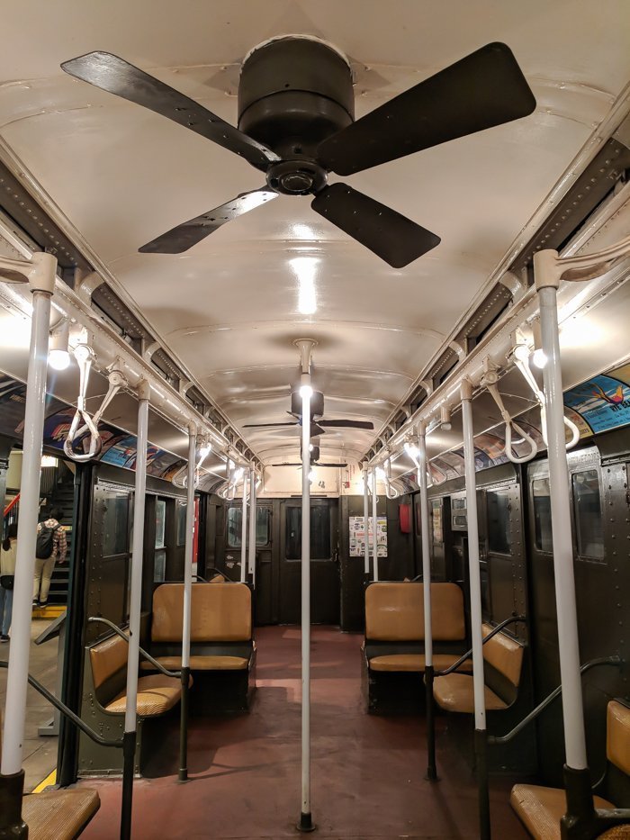 Vintage subway car with ceiling fans at Brooklyn's New York Transit Museum // Underground and Underrated | The best New York City museum you've never heard of | New York City hidden gem | #NewYorkCity #museum #transitmuseum #brooklyn #nycmuseum #traveltip #timebudgettravel