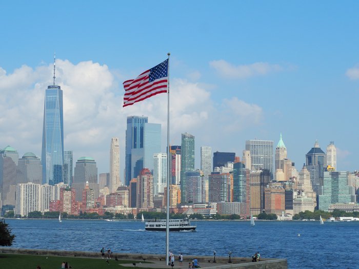 A Time-Budget Traveler's Guide to Visiting Ellis Island in a Hurry | New York City, Manhattan and the Statue of Liberty | United States Immigration Museum | National Park Site #ellisisland #newyorkcity #stateofliberty #nyc #manhattan #ushistory american flag