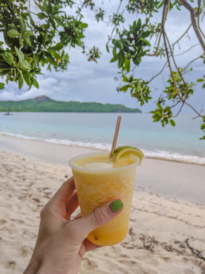 Pineapple daiquiri in Costa Rica, Getting Sick While Traveling Abroad // What to Do and How to Deal | Travel insurance, prepare for getting sick abroad, when to see a doctor, emergency room experience, medicine and medical care abroad, and more. #sickabroad #traveltips #travelguide #healthytravel #healthtips #travelinsurance