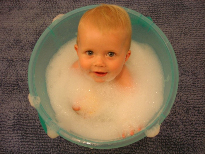 Baby in a bucket of bubbles, from pixabay