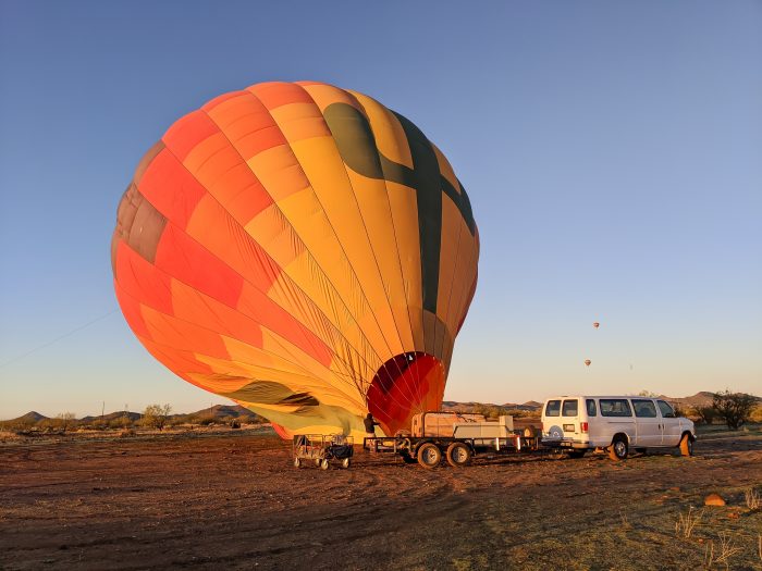 Inflating the hot air balloon | What You Need to Know for Your Sunrise Hot Air Balloon Ride in Arizona | Scottsdale and Phoenix, Arizona hot air balloon rides with Hot Air Expeditions