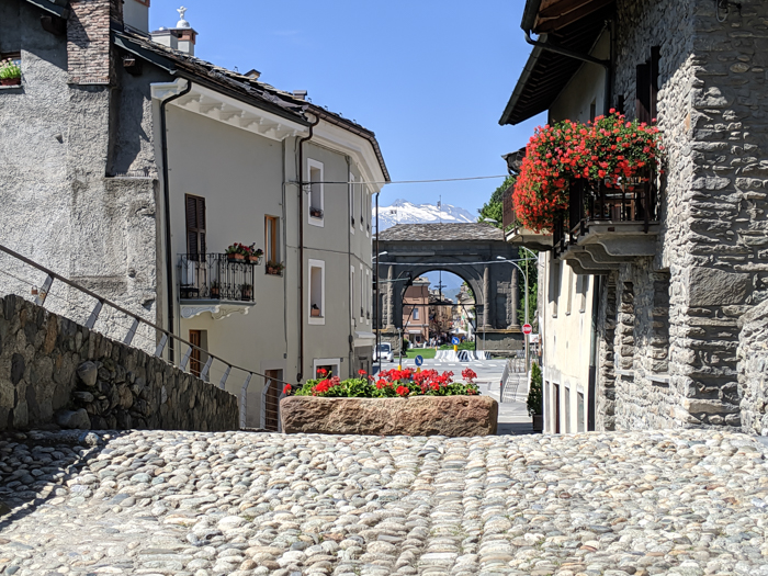 Arch of Augustus from the bridge | How to Spend 1 Day in Aosta, Italy // The Capital of the Aosta Valley | Things to see in Aosta, Things to do in Aosta, Where to eat in Aosta, the smallest of Italy's 20 regions #aosta #italy #aostavalley #traveltips #timebudgettravel #romanruins #ancient #ruins