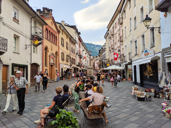 Strolling the streets during Passegiatta | How to Spend 1 Day in Aosta, Italy // The Capital of the Aosta Valley | Things to see in Aosta, Things to do in Aosta, Where to eat in Aosta, the smallest of Italy's 20 regions #aosta #italy #aostavalley #traveltips #timebudgettravel #romanruins #ancient #ruins 