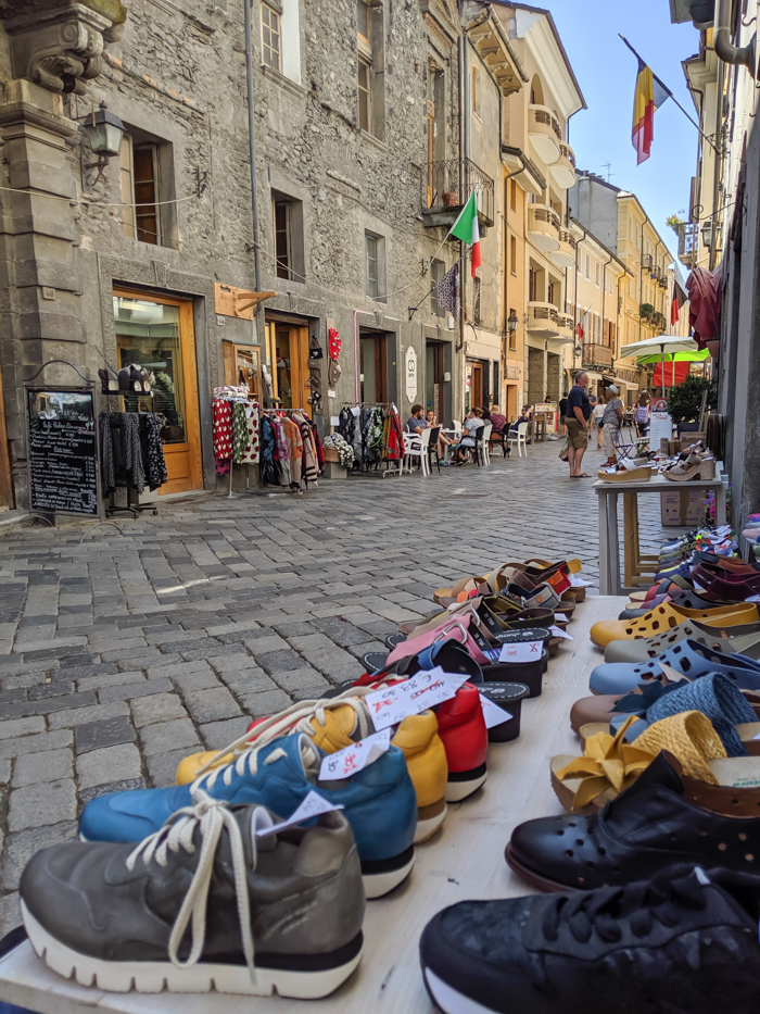 Strolling the streets during Passegiatta, shoe shop | How to Spend 1 Day in Aosta, Italy // The Capital of the Aosta Valley | Things to see in Aosta, Things to do in Aosta, Where to eat in Aosta, the smallest of Italy's 20 regions #aosta #italy #aostavalley #traveltips #timebudgettravel #romanruins #ancient #ruins 