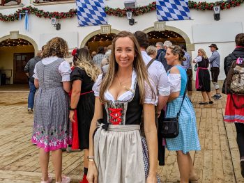 me in a dirndl outside an oktoberfest beer tent