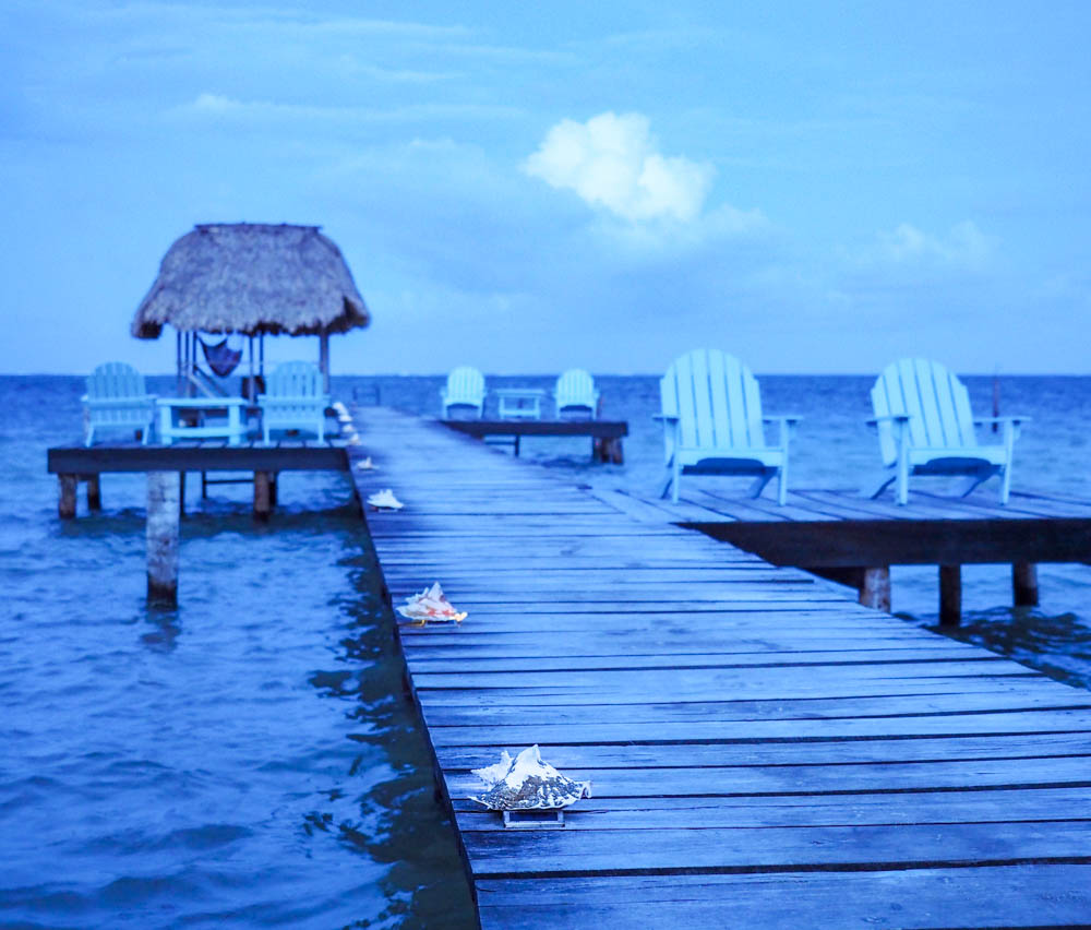 Belize island dock at blue hour seashells