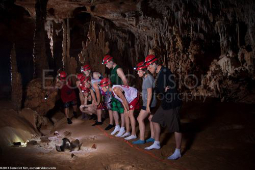 People wearing socks inside the ATM Cave / What to pack for the ATM Cave in Belize: What to wear, what shoes to wear, what to bring, and what to never, ever bring into the ATM Cave.