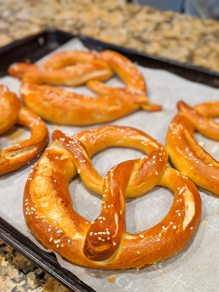 Cooked pretzels on a baking sheet