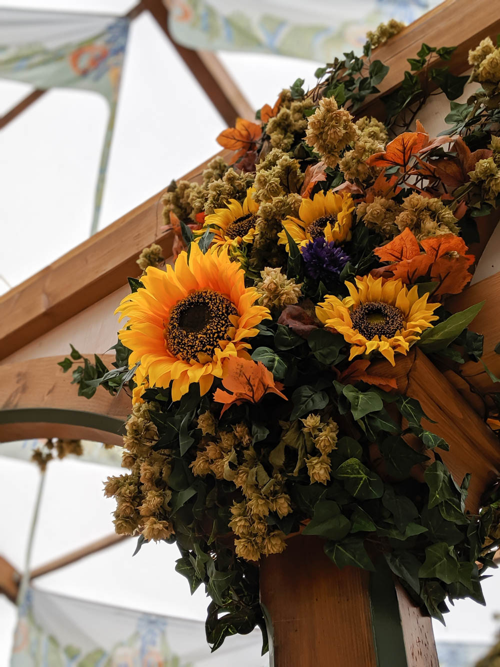 How to decorate for an Oktoberfest party at home: sunflower decorations inside the Hofbrau tent