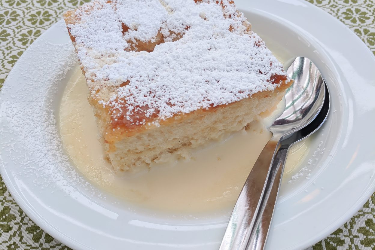 dampfnudel on a plate on a green and white table cloth