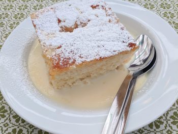 dampfnudel on a plate on a green and white table cloth