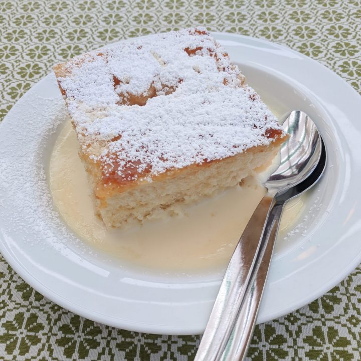 dampfnudel on a plate on a green and white table cloth