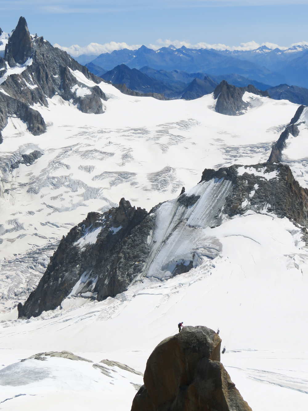 Aiguille du Midi summer visitor's guide, Chamonix, France: lone hiker and Panoramic Mont Blanc cable car to Pointe Helbronner