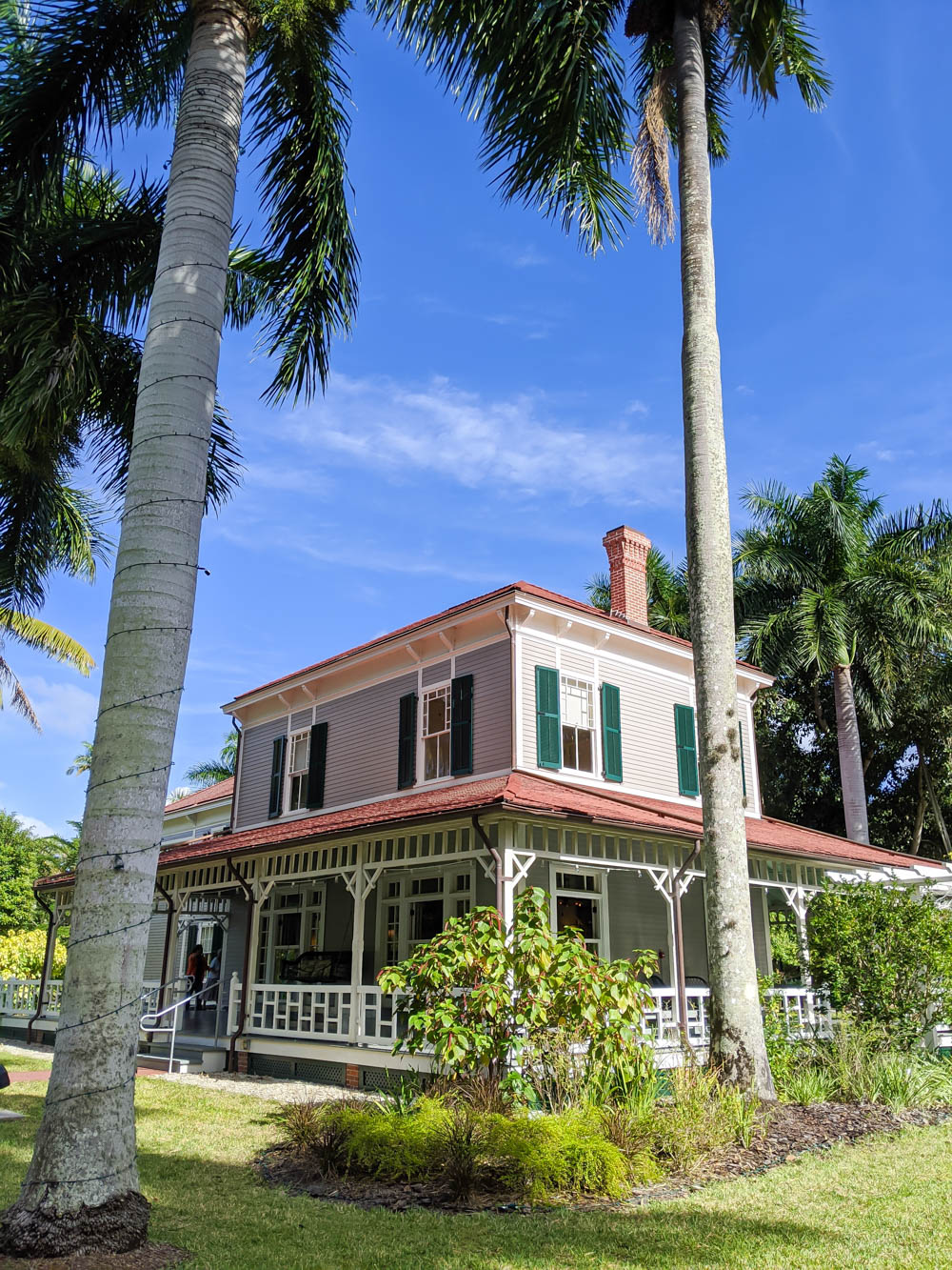 large estate surrounded by palm trees