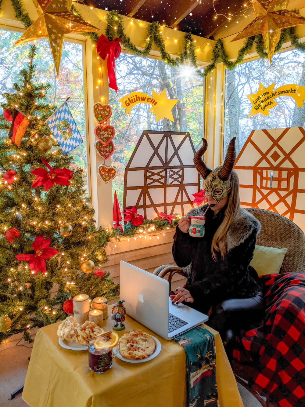 Krampus drinking hot chocolate amidst a German Christmas market at home