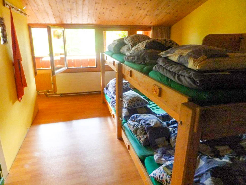 Mountain Hostel bunk bed rooms | Where to stay in Gimmelwald, Switzerland: Mountain Hostels and B&Bs | Best places to stay in Gimmelwald