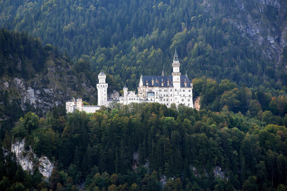 Neuschwanstein Castle from a distance | Where to stay near Neuschwanstein Castle: 12 Best Hotels and Airbnbs in Hohenschwangau, Schwangau, and Füssen