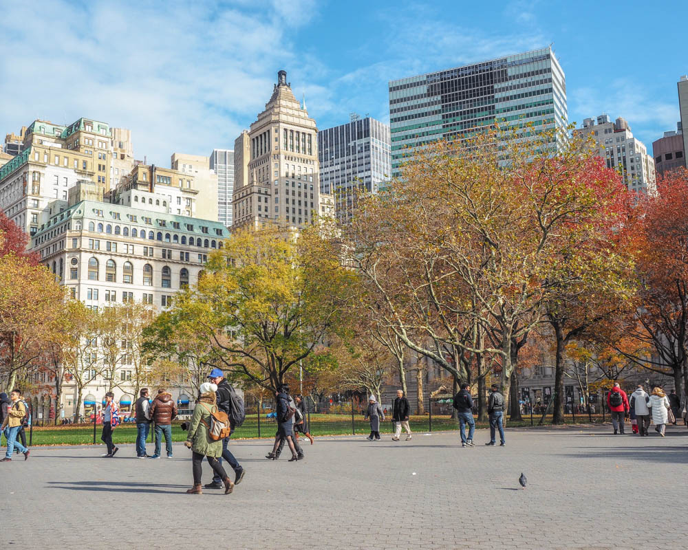 Manhattan skyline in the fall with orange and yellow trees