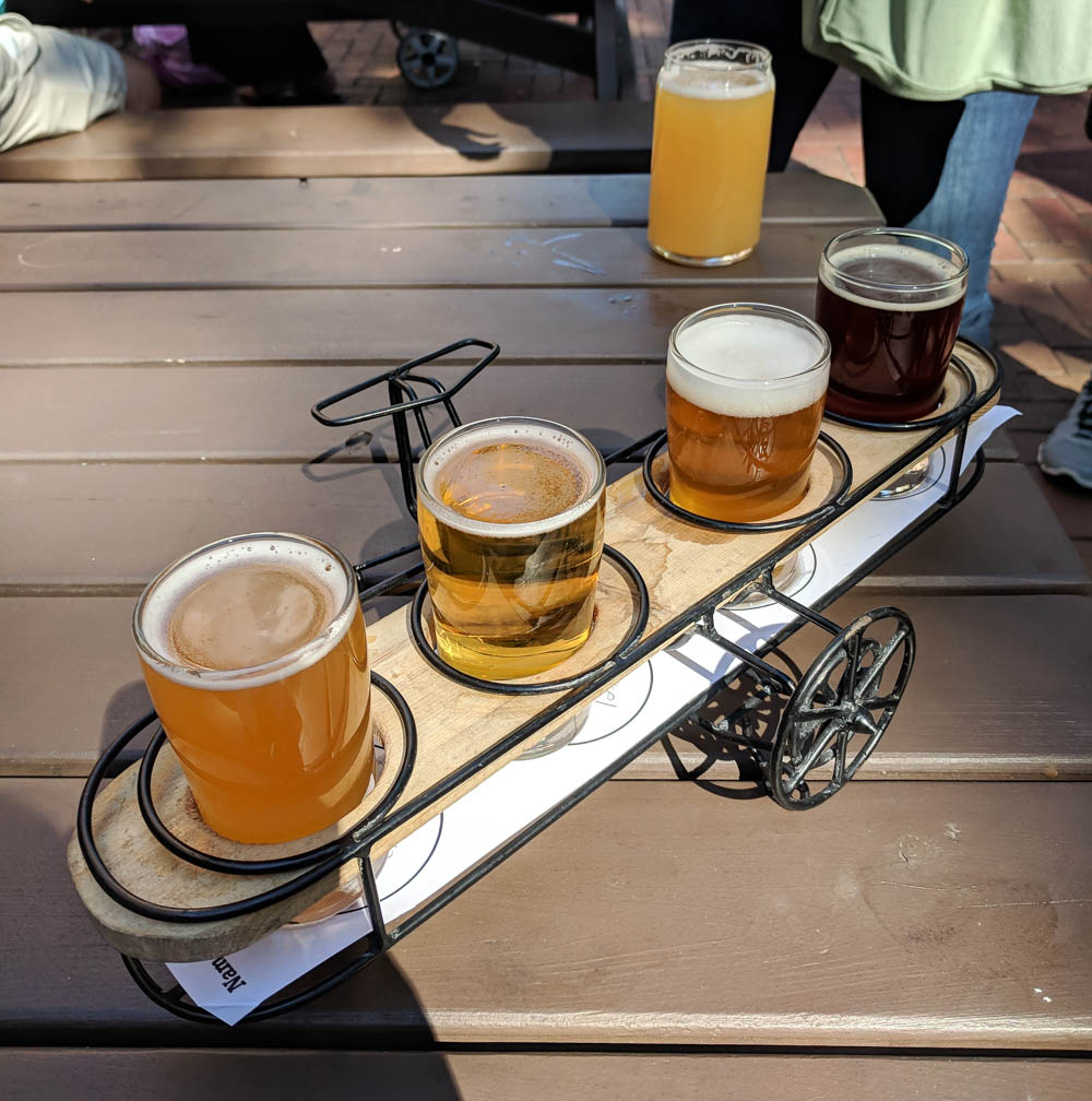 beer samples in an airplane-shaped holder